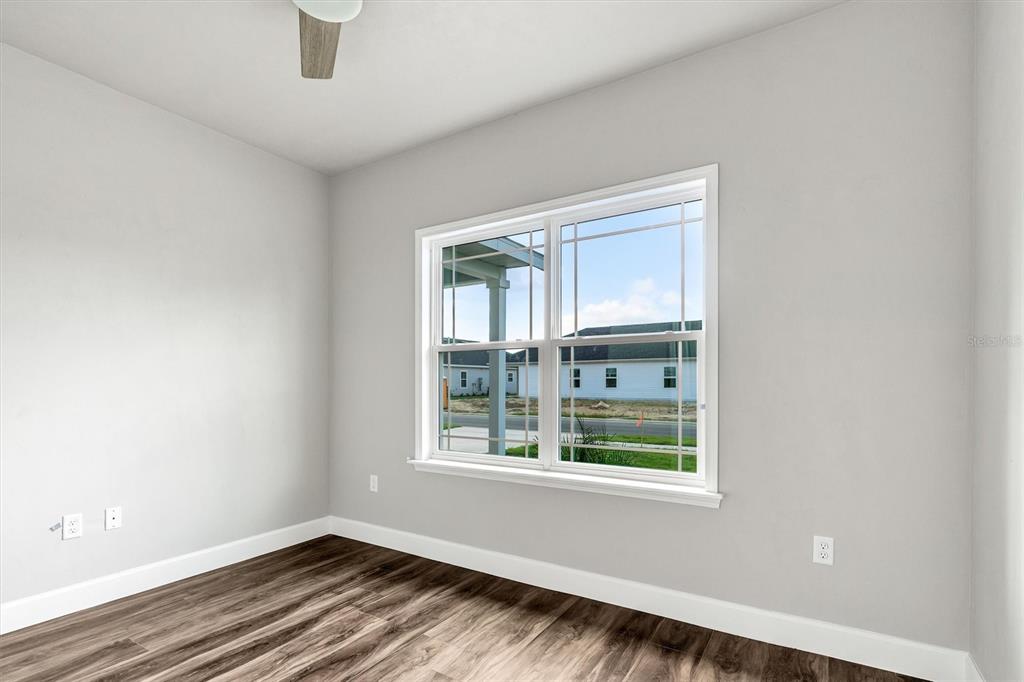1140 Southwest 67th Street Gainesville, FL 32607 - Photo 12 of 65 a view of an empty room with a window