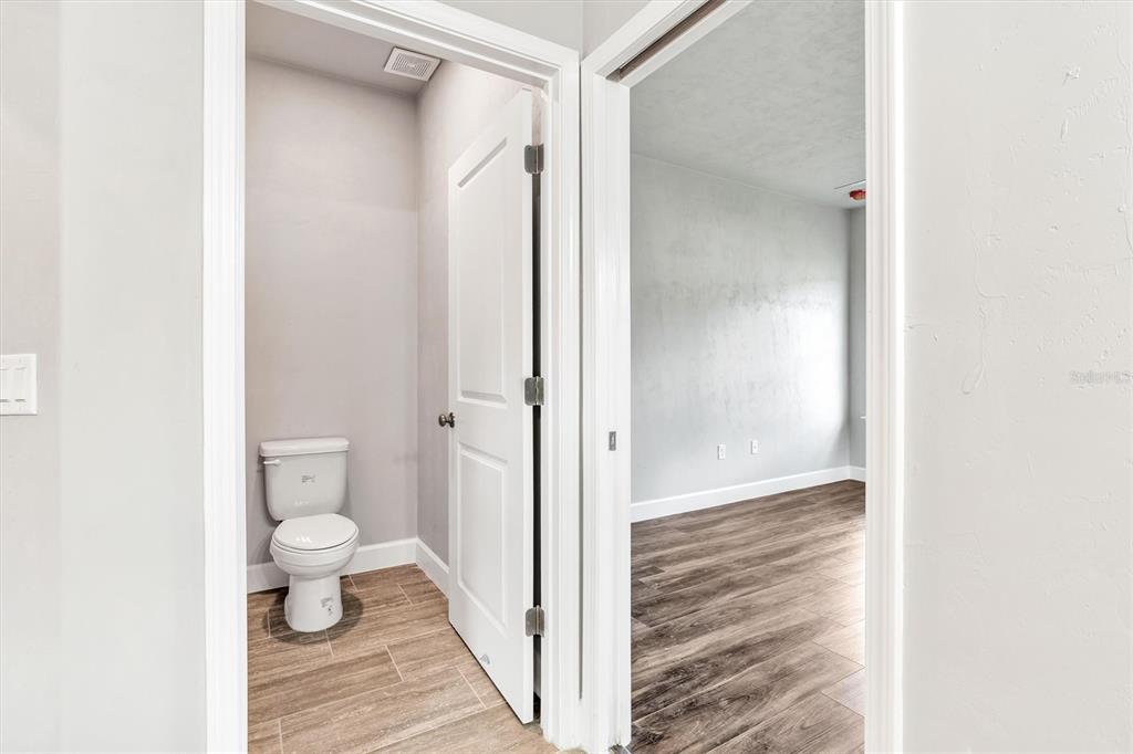 1140 Southwest 67th Street Gainesville, FL 32607 - Photo 34 of 65 a view of a bathroom from a hallway