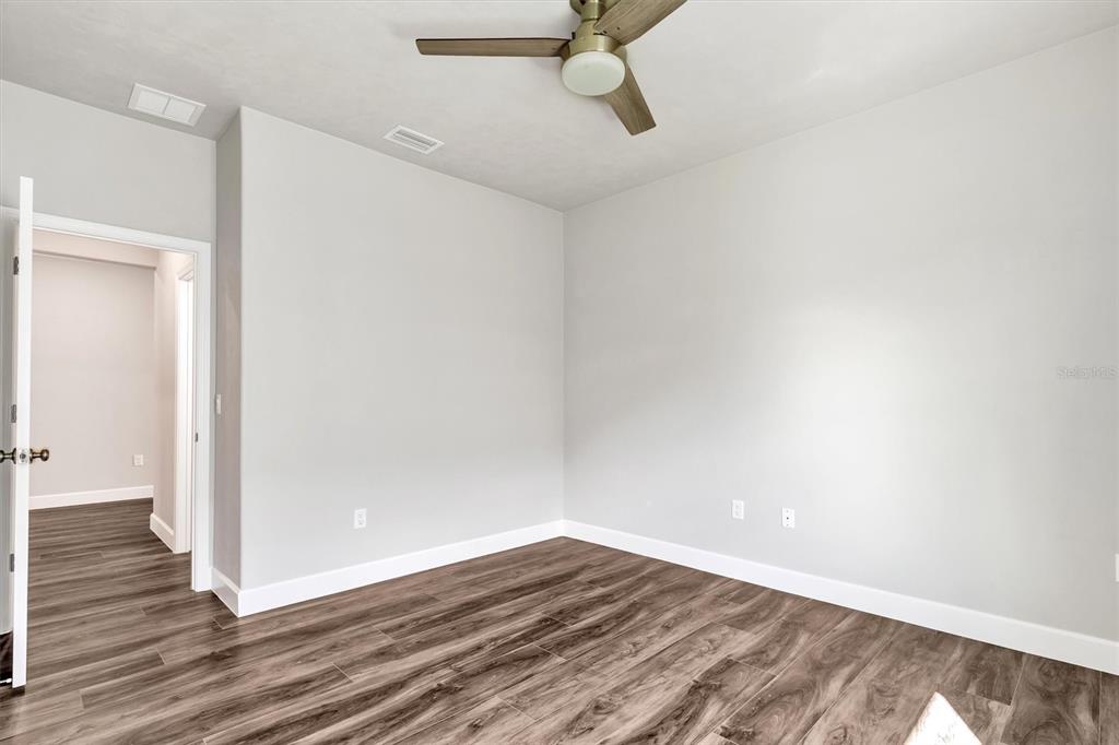 1140 Southwest 67th Street Gainesville, FL 32607 - Photo 43 of 65 a view of a room with wooden floor
