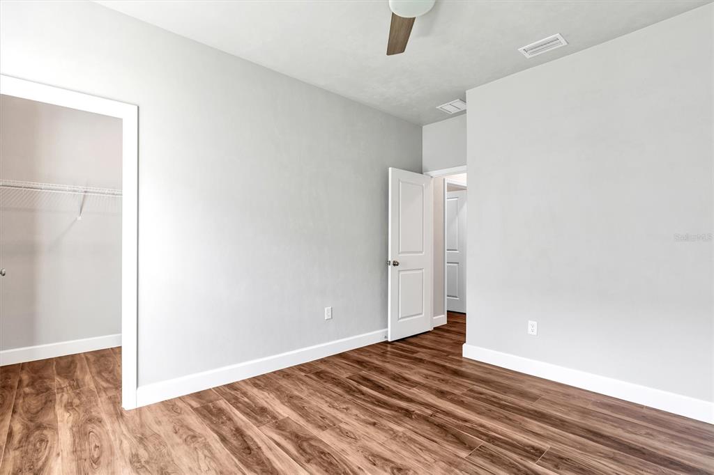 1140 Southwest 67th Street Gainesville, FL 32607 - Photo 44 of 65 a view of empty room with wooden floor