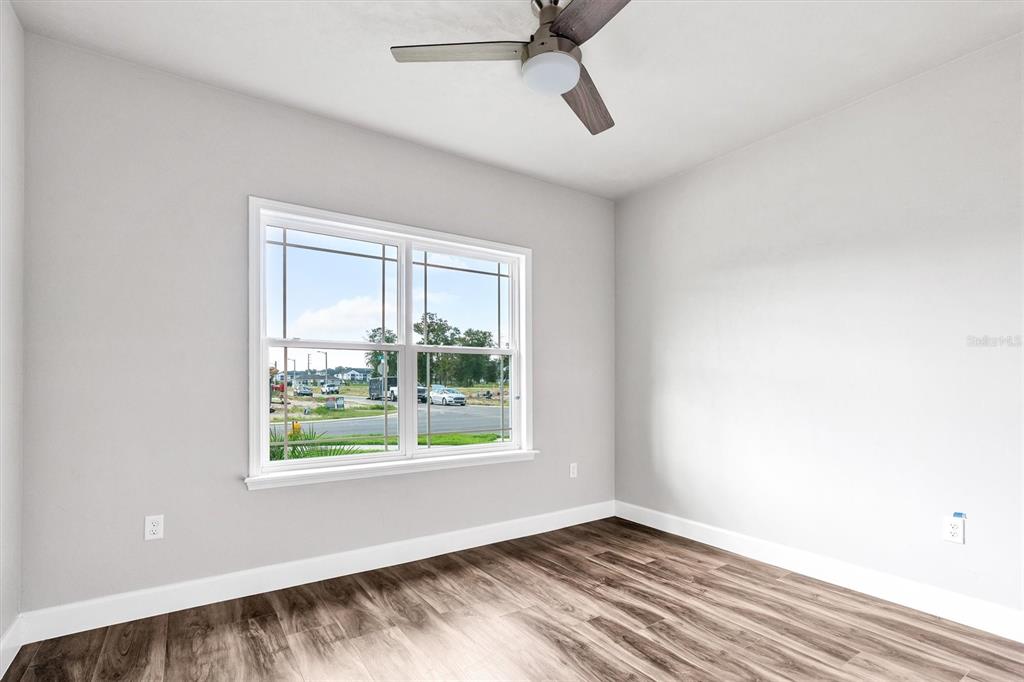 1140 Southwest 67th Street Gainesville, FL 32607 - Photo 9 of 65 a view of room with window and ceiling fan