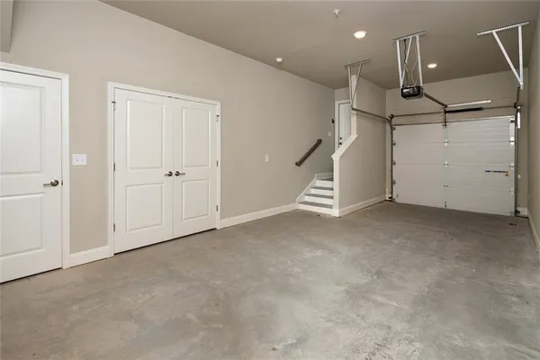 a view of a house with swimming pool and sitting area