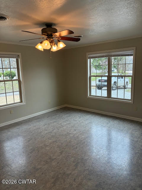 482 Main Street Friendship, TN 38034 - Photo 12 of 27 an empty room with windows and chandelier fan