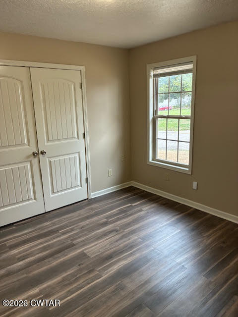 482 Main Street Friendship, TN 38034 - Photo 24 of 27 an empty room with wooden floor and windows