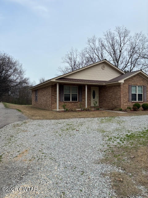 482 Main Street Friendship, TN 38034 - Photo 4 of 27 a front view of a house with a garden