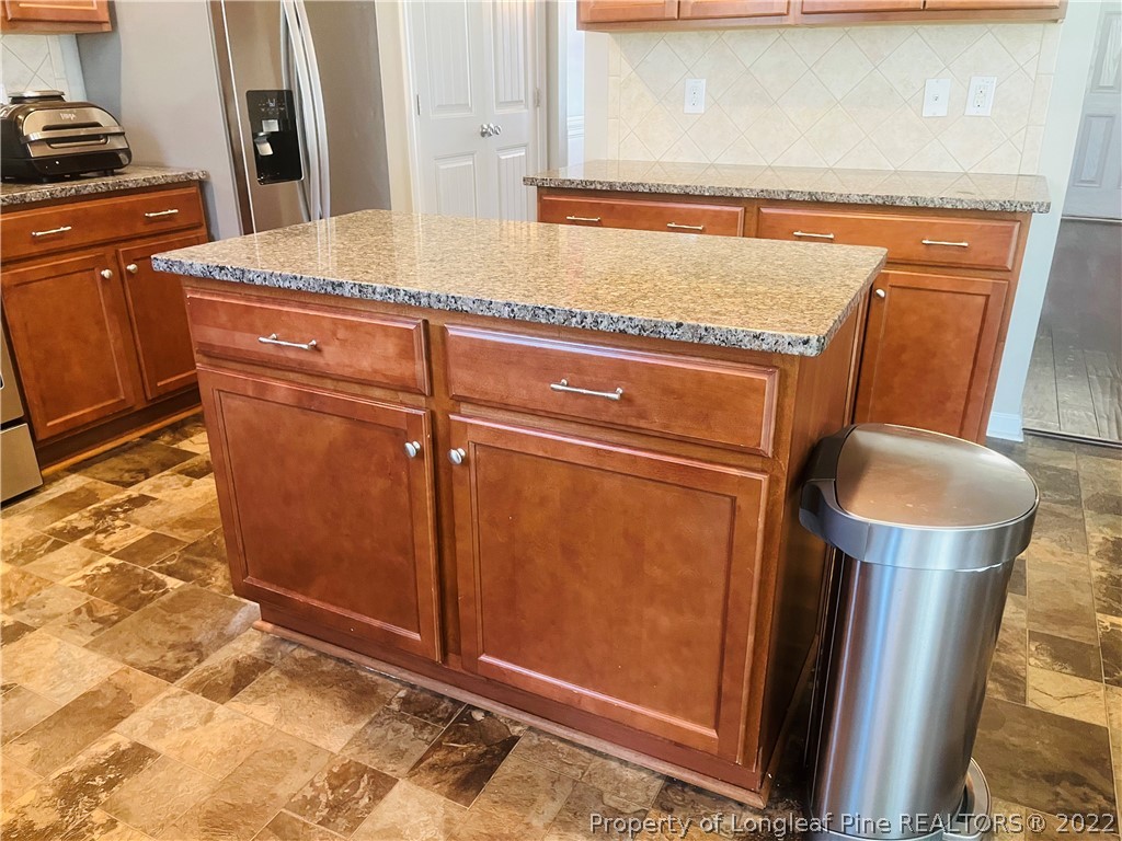 304 River Oak Street Spring Lake, NC 28390 - Photo 11 of 30 a close view of a sink and a refrigerator in a kitchen