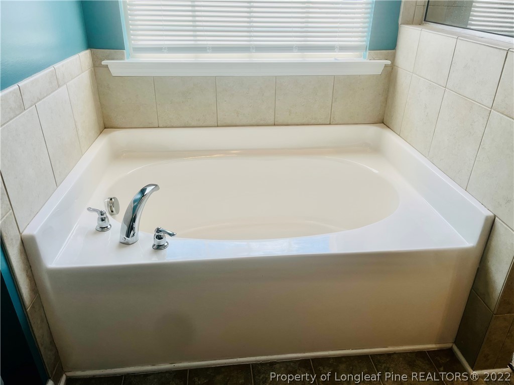 304 River Oak Street Spring Lake, NC 28390 - Photo 19 of 30 a bathroom with a bathtub