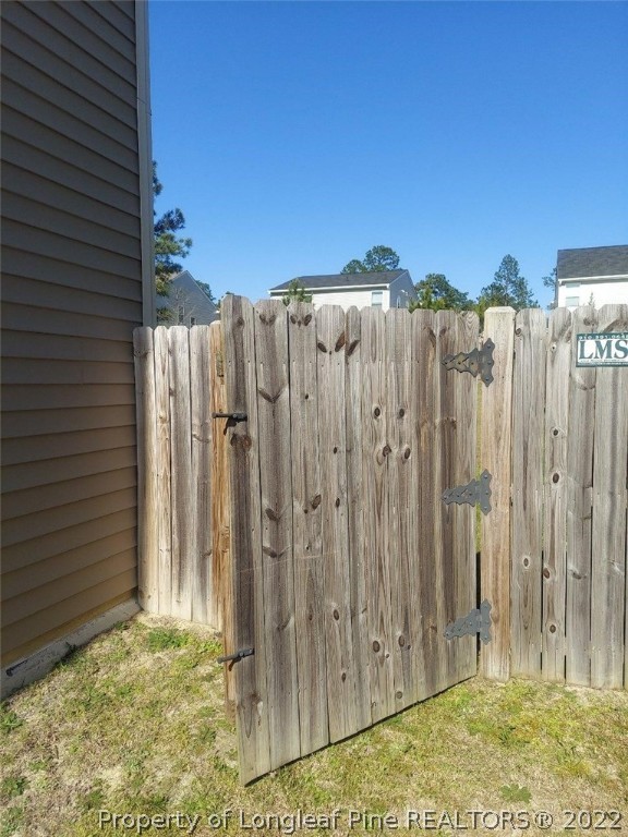 304 River Oak Street Spring Lake, NC 28390 - Photo 29 of 30 a view of a backyard with wooden fence