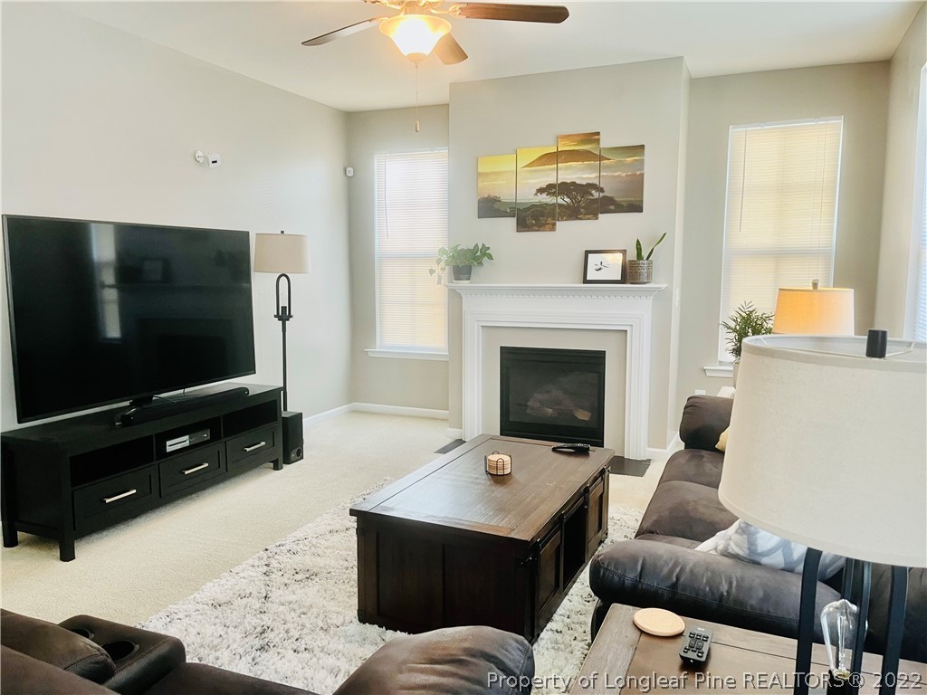 304 River Oak Street Spring Lake, NC 28390 - Photo 3 of 30 a living room with furniture and a flat screen tv