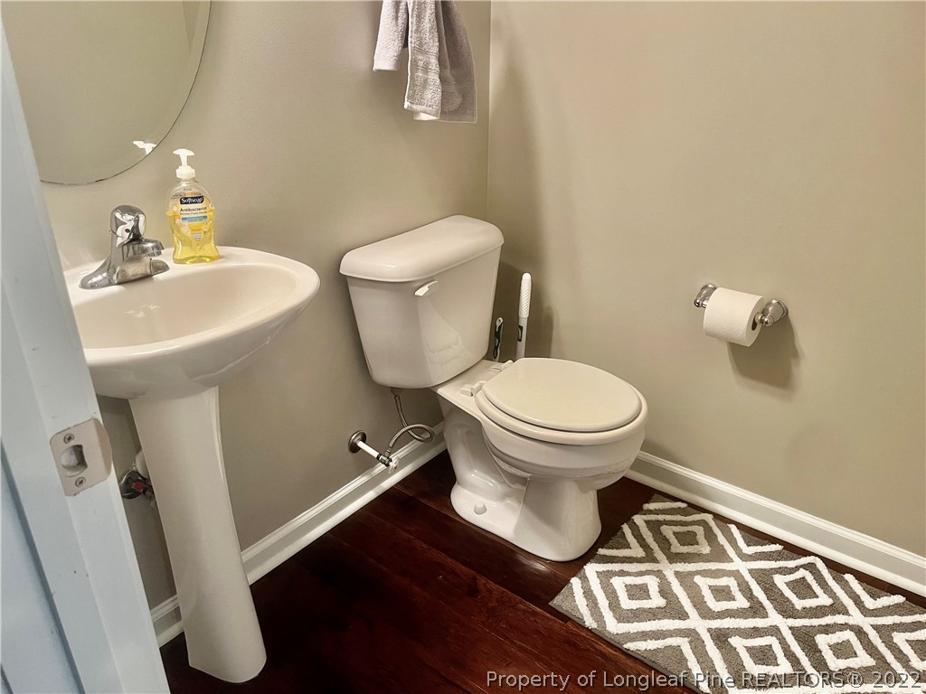 304 River Oak Street Spring Lake, NC 28390 - Photo 7 of 30 a bathroom with a toilet and a sink