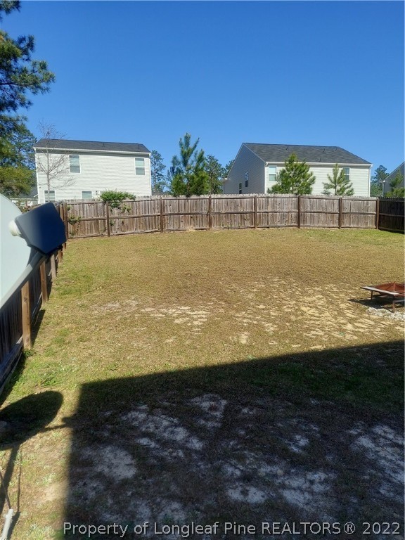 304 River Oak Street Spring Lake, NC 28390 - Photo 10 of 30 a view of a swimming pool with an outdoor seating