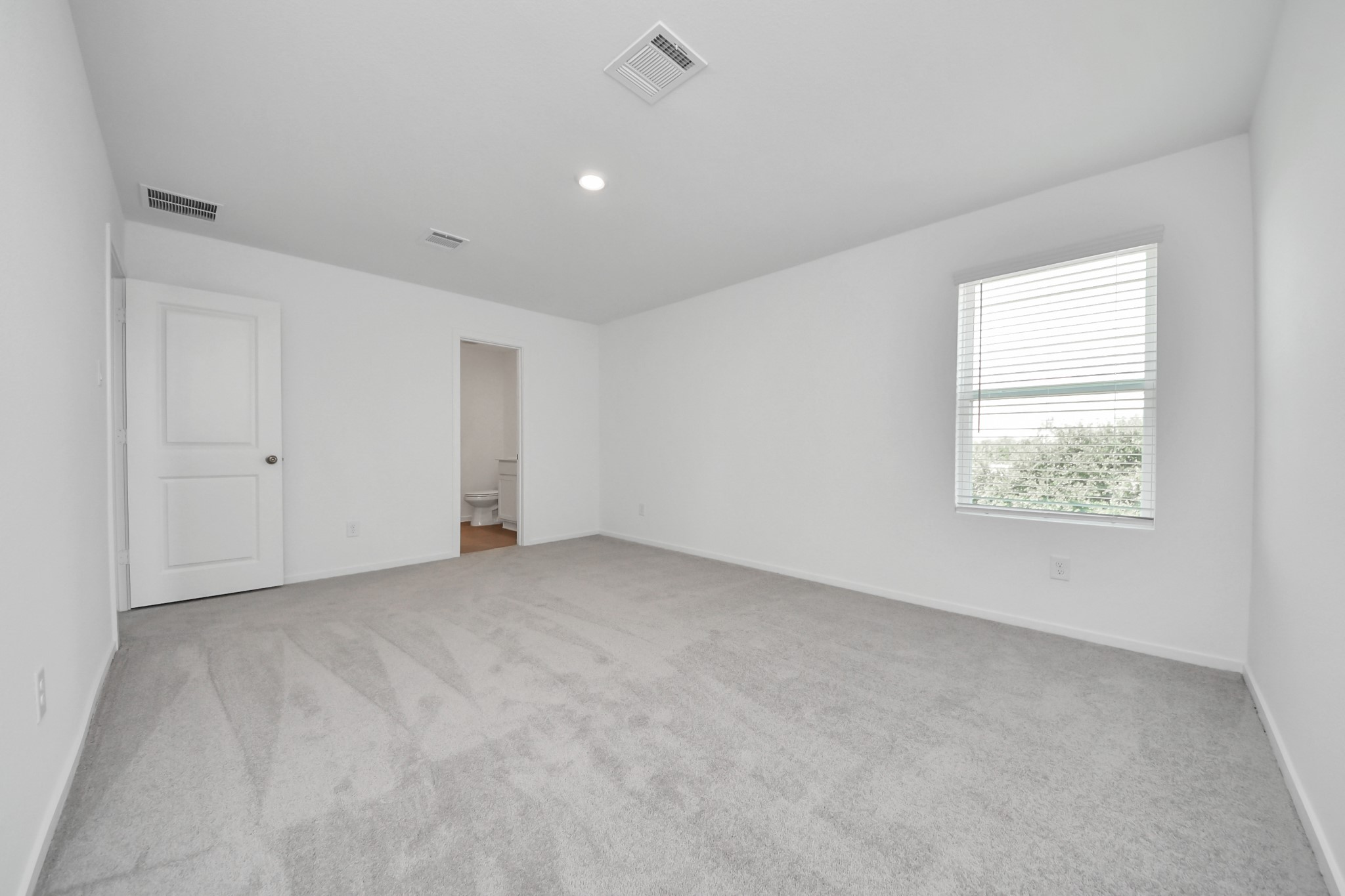 2931 Summer Breeze Way Angleton, TX 77515 - Photo 19 of 30 a view of an empty room with a window