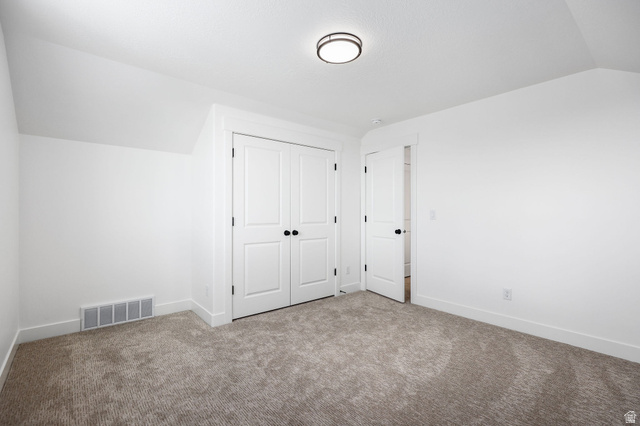1144 South 4475 West West Point, UT 84015 - Photo 25 of 30 White walls and neutral carpeting define this interior space, featuring a double-door closet with black hardware