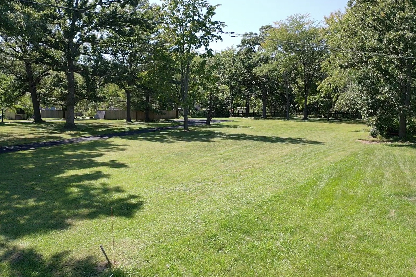 23810 South Ashland Avenue Crete, IL 60417 - Photo 8 of 10 a view of a swimming pool with a yard