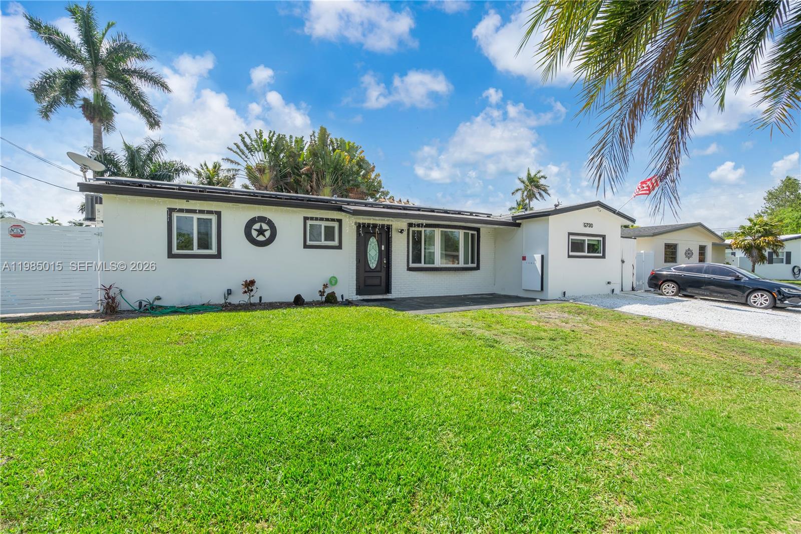 5730 Southwest 55th Street Davie, FL 33314 - Photo 1 of 34 a front view of house with yard and outdoor seating