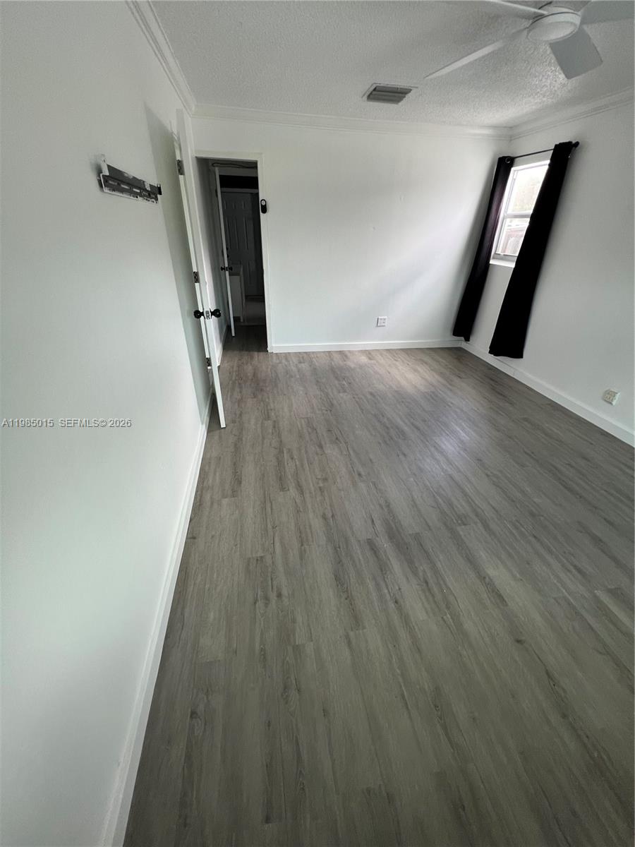 5730 Southwest 55th Street Davie, FL 33314 - Photo 12 of 34 a view of a hallway with wooden floor