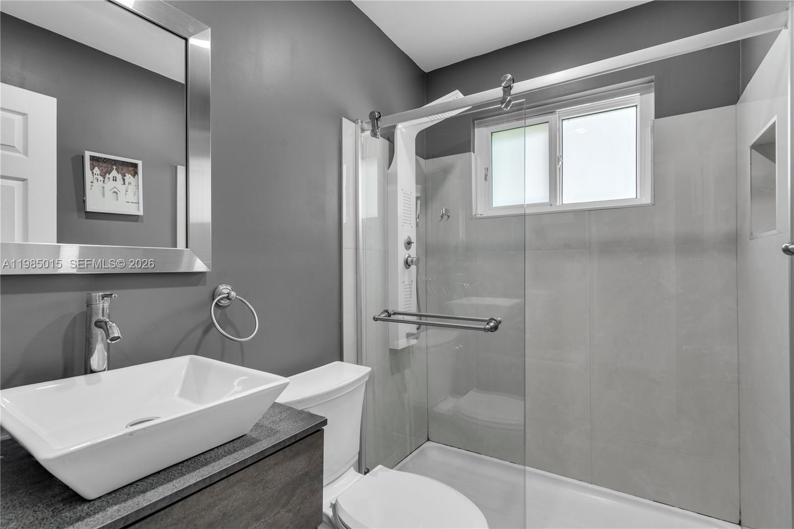 5730 Southwest 55th Street Davie, FL 33314 - Photo 16 of 34 a bathroom with a sink toilet and shower