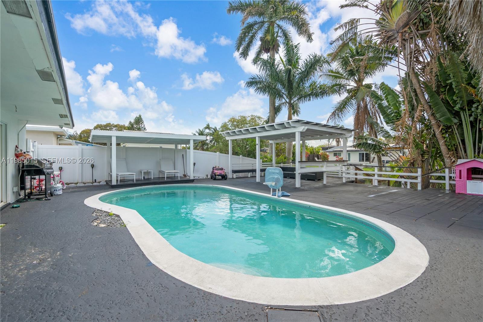 5730 Southwest 55th Street Davie, FL 33314 - Photo 17 of 34 a view of a swimming pool with a patio