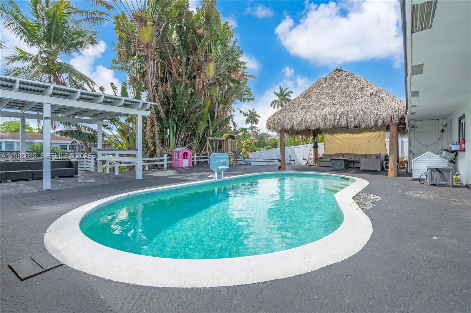 5730 Southwest 55th Street Davie, FL 33314 - Photo 19 of 34 a view of a swimming pool with a patio