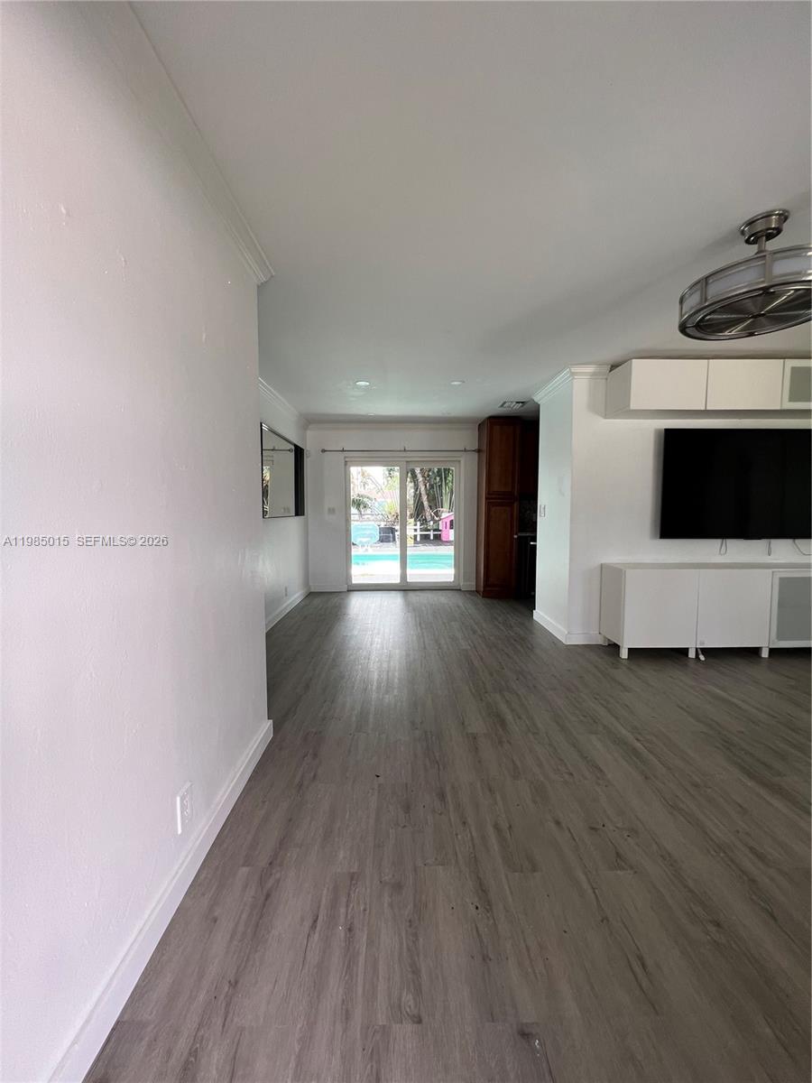 5730 Southwest 55th Street Davie, FL 33314 - Photo 6 of 34 a view of empty room with wooden floor and fireplace