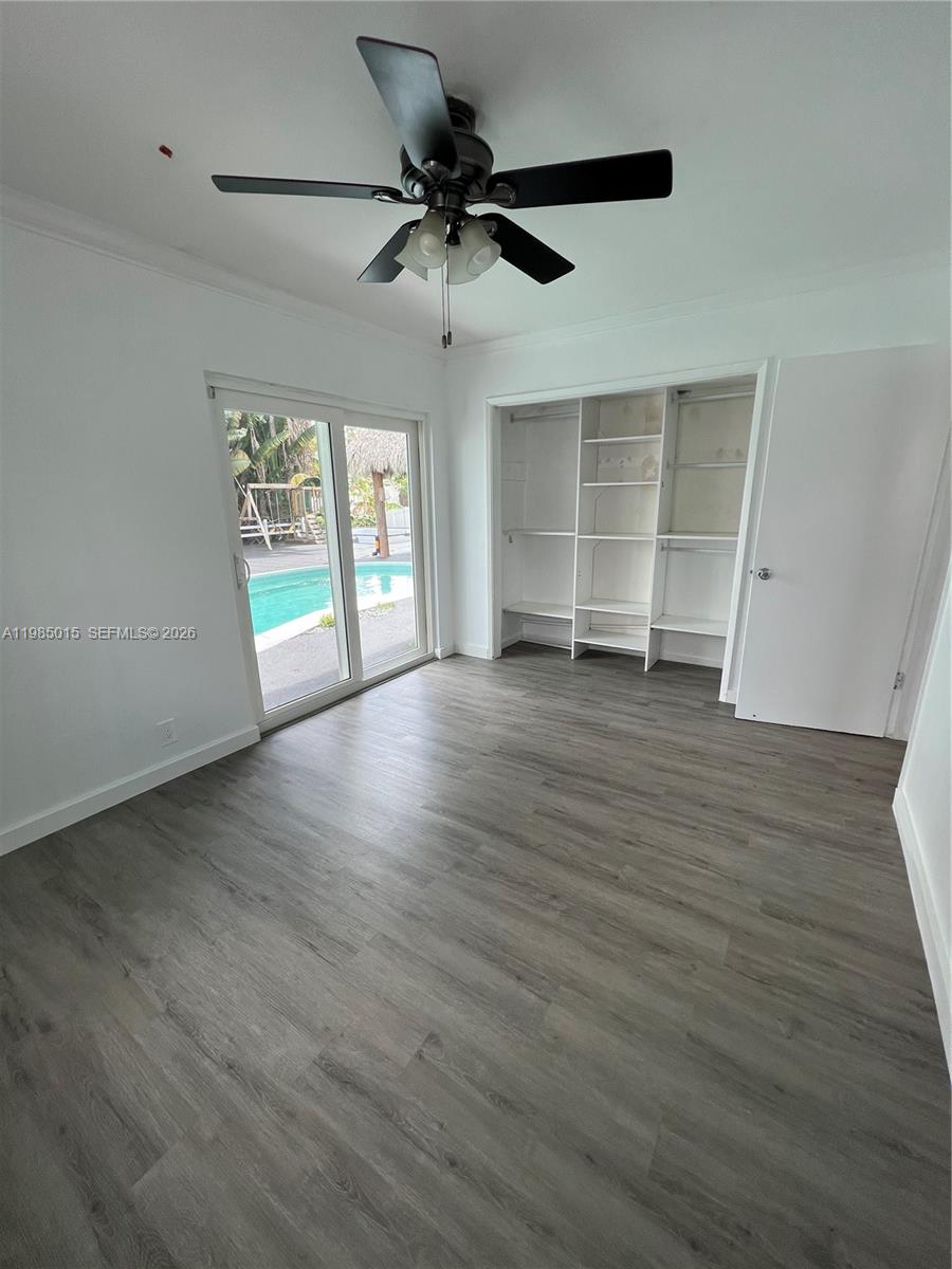 5730 Southwest 55th Street Davie, FL 33314 - Photo 7 of 34 wooden floor in an empty room with a window