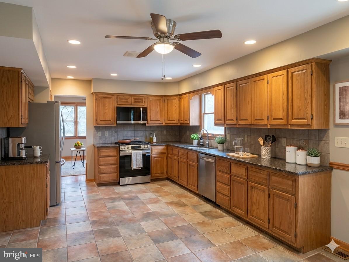 620 Columbia Road Egg Harbor City, NJ 08215 - Photo 31 of 53 a large kitchen with stainless steel appliances granite countertop a stove sink and cabinets