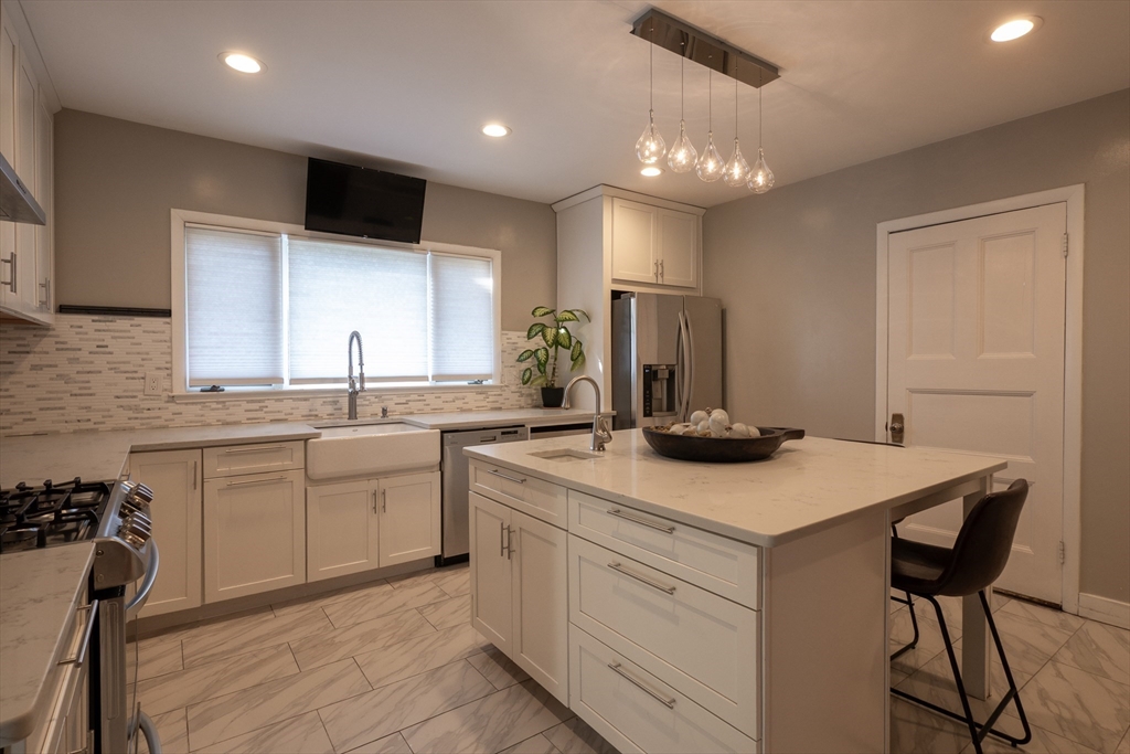 11 Wayne Street Boston, MA 02121 - Photo 8 of 27 a kitchen with a sink and cabinets