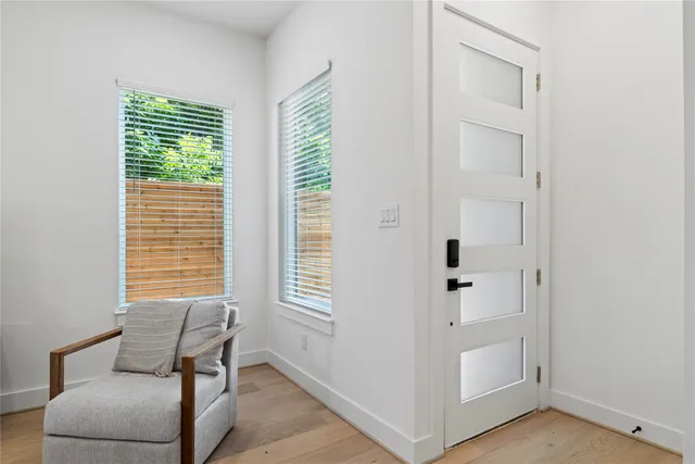 a view of room with windows and lounge chair