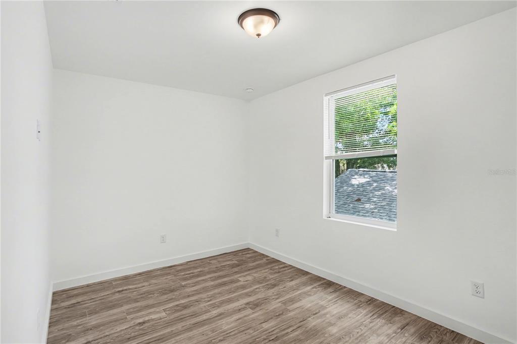 2328 West Spruce Street, Unit A Tampa, FL 33607 - Photo 11 of 15 an empty room with a window
