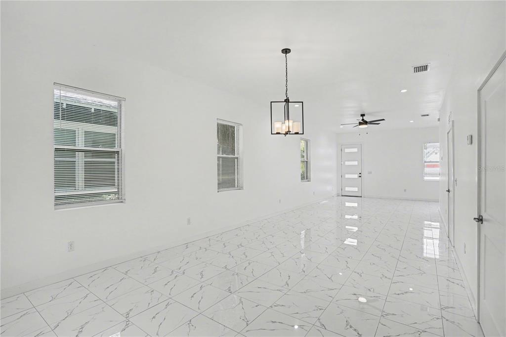 2328 West Spruce Street, Unit A Tampa, FL 33607 - Photo 3 of 15 a view of empty room with windows