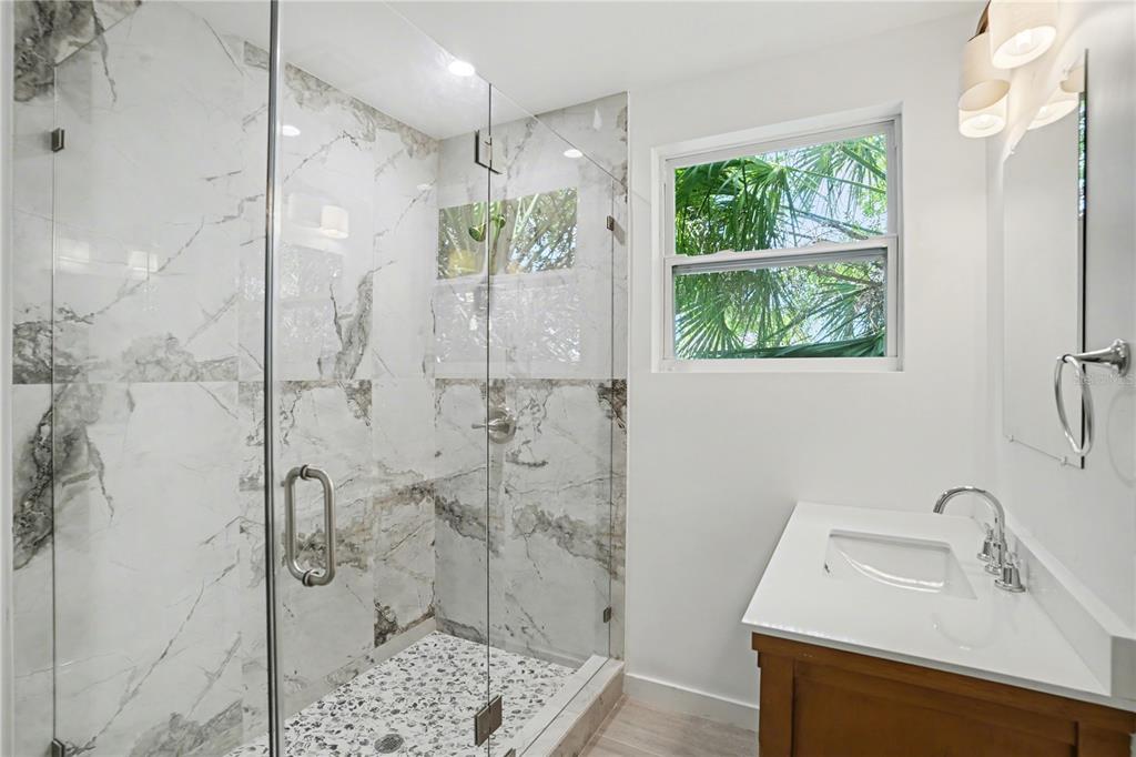 2328 West Spruce Street, Unit A Tampa, FL 33607 - Photo 10 of 15 a bathroom with a shower and a sink