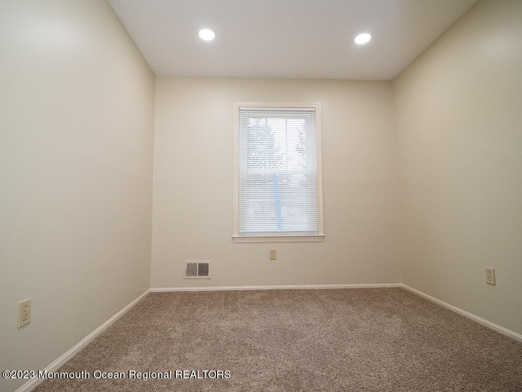 459 Magnolia Court Howell, NJ 07731 - Photo 11 of 22 an empty room with a window