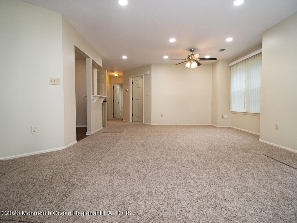459 Magnolia Court Howell, NJ 07731 - Photo 3 of 22 a view of a big room with a ceiling fan