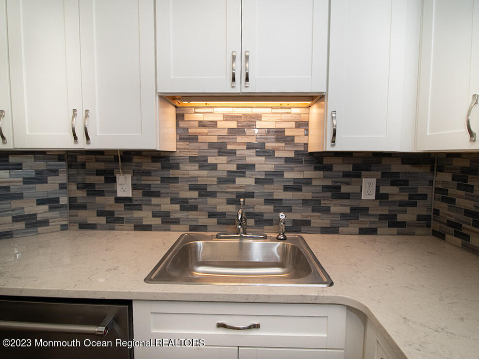 459 Magnolia Court Howell, NJ 07731 - Photo 7 of 22 a kitchen with a sink and cabinets