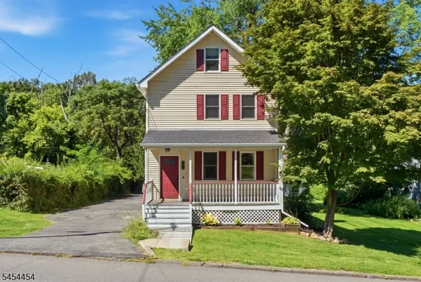 a house with trees in the background