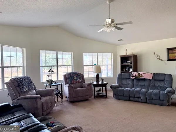 a living room with furniture and a window