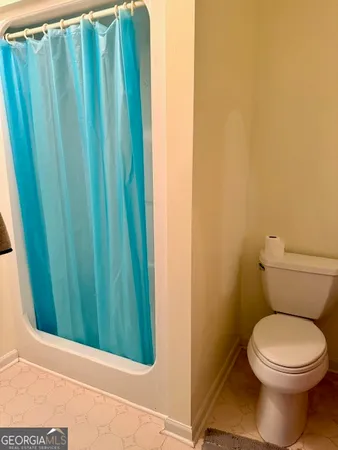 a bathroom with a toilet and a sink