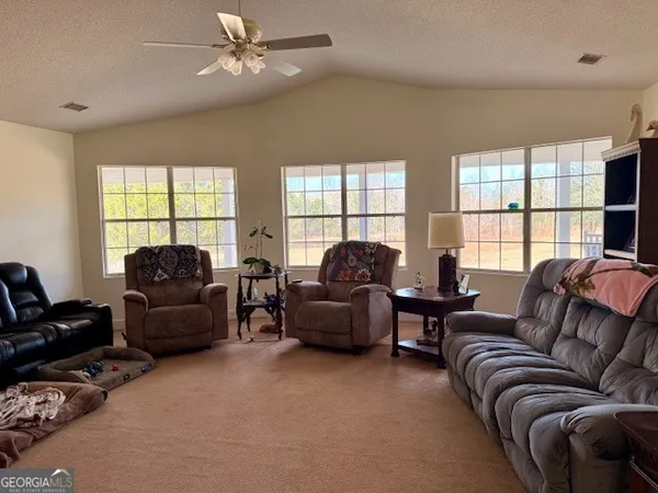 a living room with furniture and a window