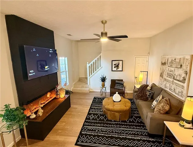 a living room with furniture and a rug