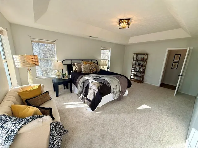 a bedroom with furniture and a couch