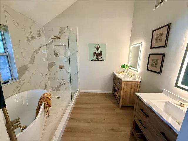 a bathroom with a sink a toilet and a bathtub