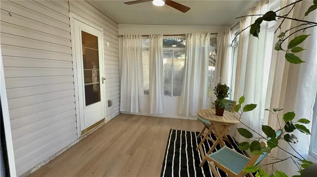 a view of a balcony with furniture