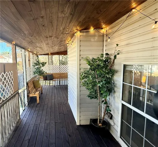 a view of balcony with wooden floor