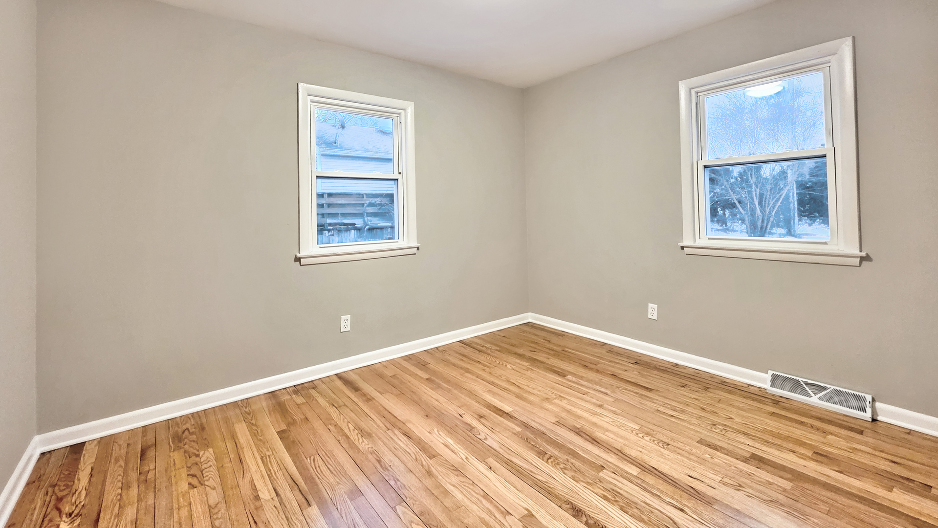 1509 Pine Street McHenry, IL 60051 - Photo 15 of 17 a view of empty room with wooden floor and fan