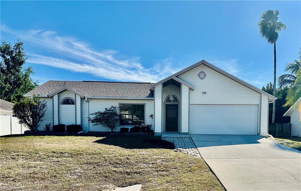 9108 Caloosa Road Fort Myers, FL 33967 - Photo 1 of 19 a front view of house with yard