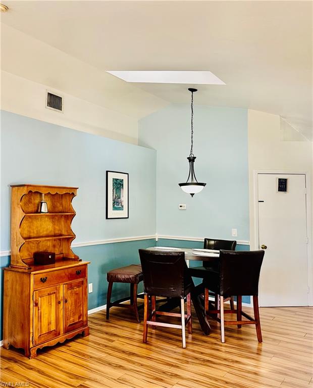 9108 Caloosa Road Fort Myers, FL 33967 - Photo 6 of 19 a dining room with furniture and wooden floor