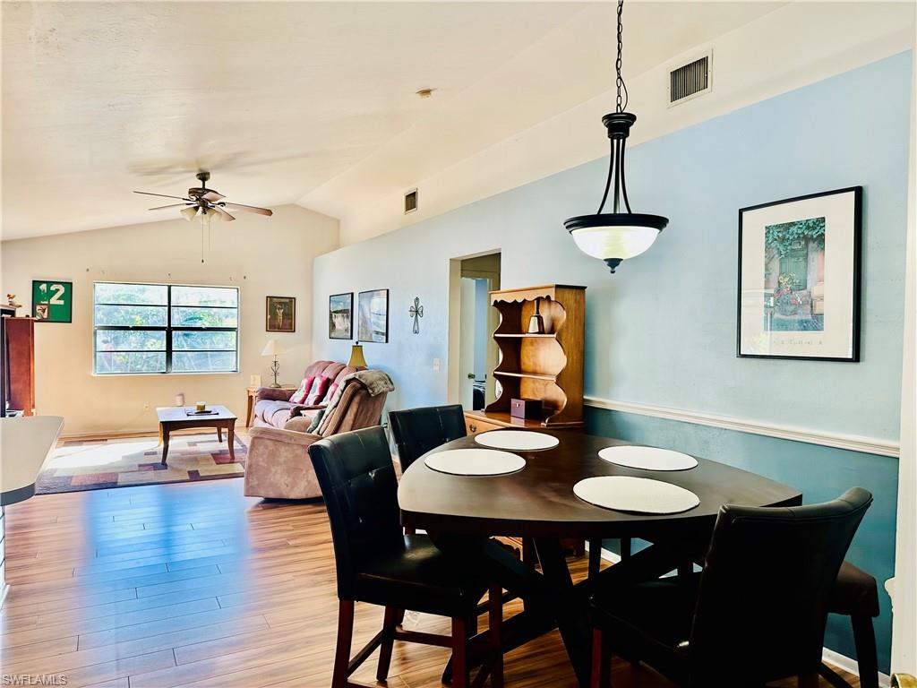 9108 Caloosa Road Fort Myers, FL 33967 - Photo 7 of 19 a view of a dining room with furniture window and wooden floor