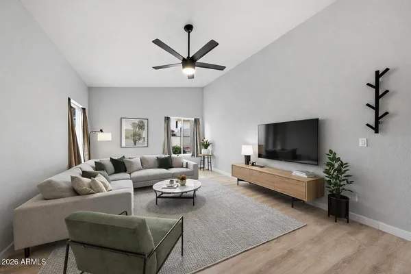 a living room with furniture and a flat screen tv