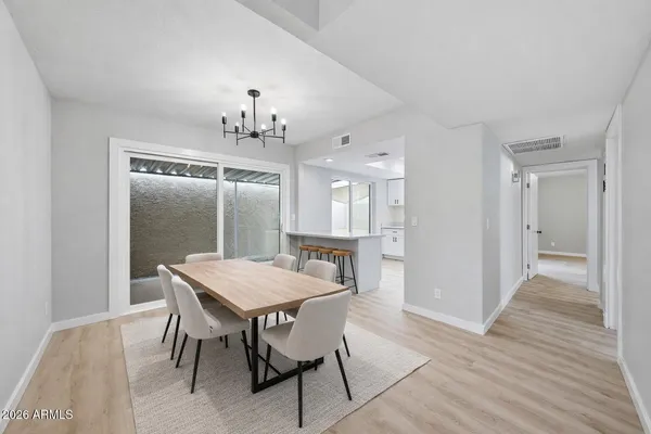 a view of a dining room with furniture and wooden floor