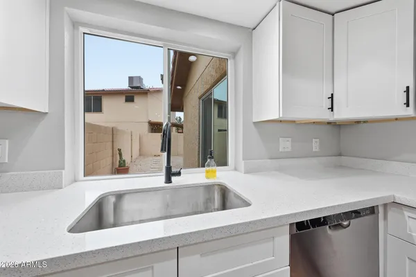 a kitchen with a sink and a cabinets